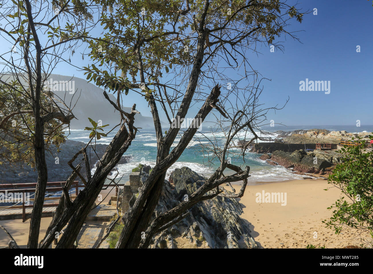 View across sandy beach into the Indian Ocean from Tsitsikamma National Park mouth trail, Garden Route, Cape, South Africa Stock Photo