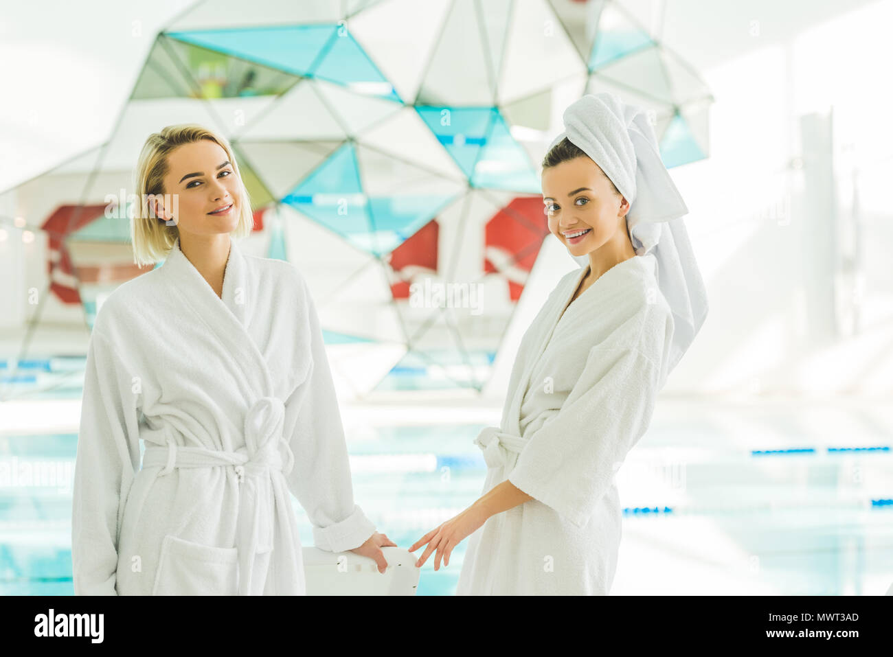 beautiful young women in bathrobes at spa center Stock Photo Alamy