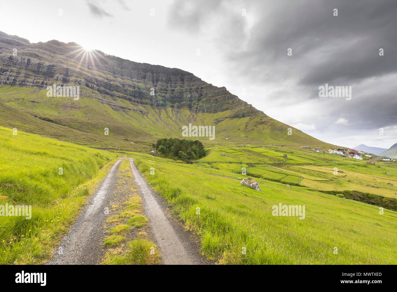 Sunbeam on green meadows, Kunoy Island, Nordoyar, Faroe Islands, Denmark, Europe Stock Photo