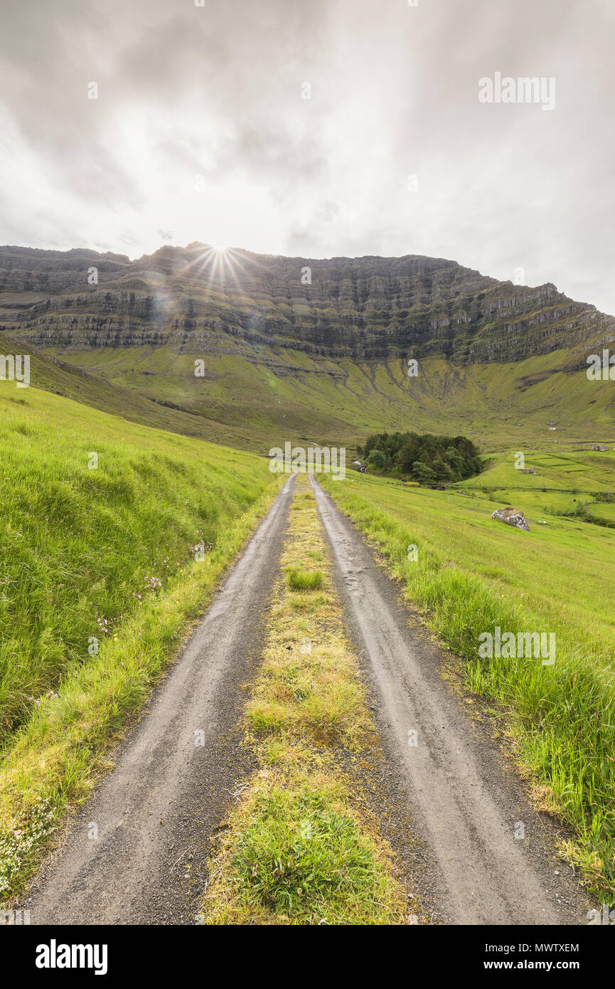 Path through green meadows, Kunoy Island, Nordoyar, Faroe Islands, Denmark, Europe Stock Photo