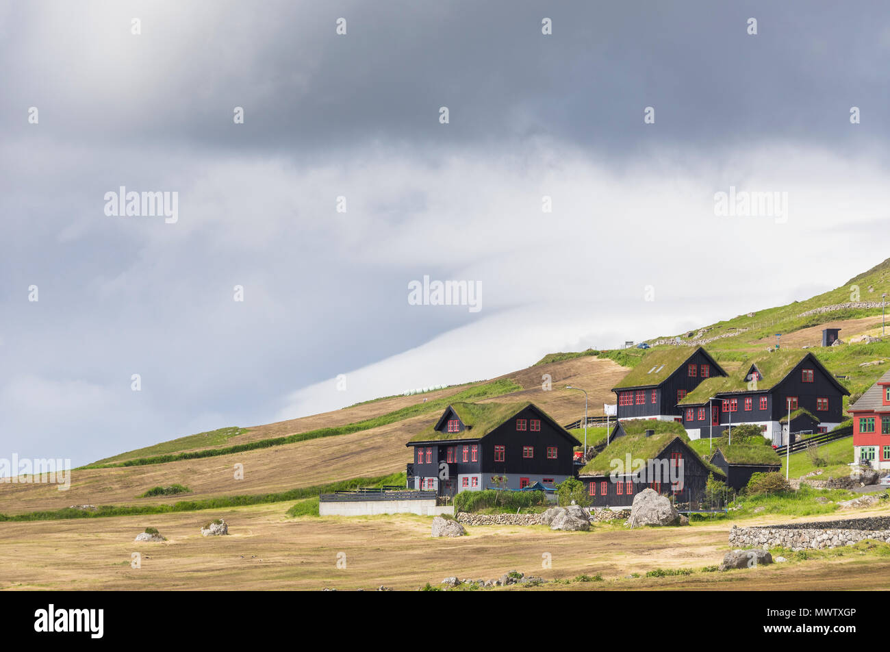 Traditional houses with grass (turf) roof, Kirkjubour, Streymoy island, Faroe Islands, Denmark, Europe Stock Photo