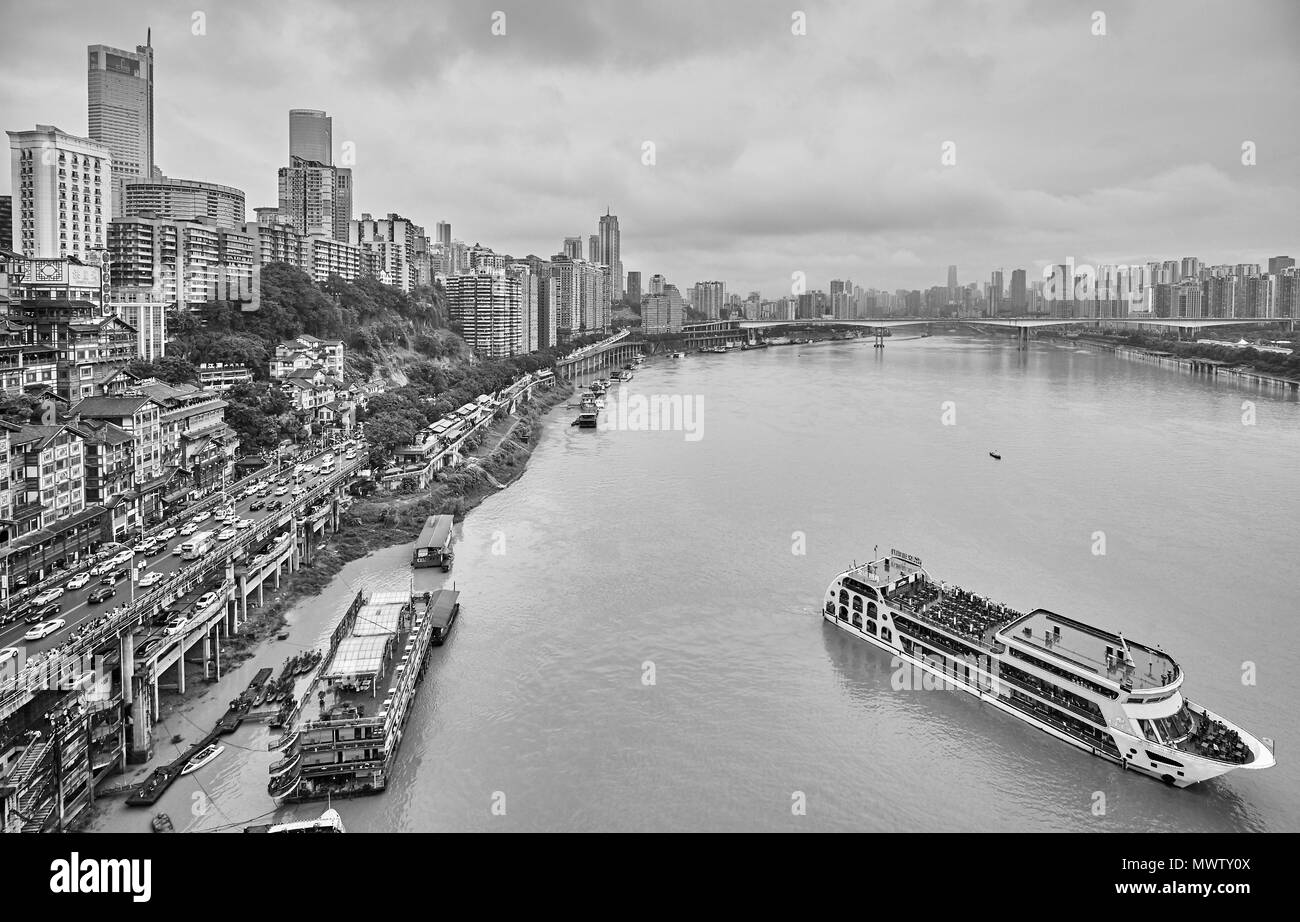 Chongqing, China - October 03, 2017: Cruise ship leaves harbor. The city is an economic centre of the upstream Yangtze basin. Stock Photo