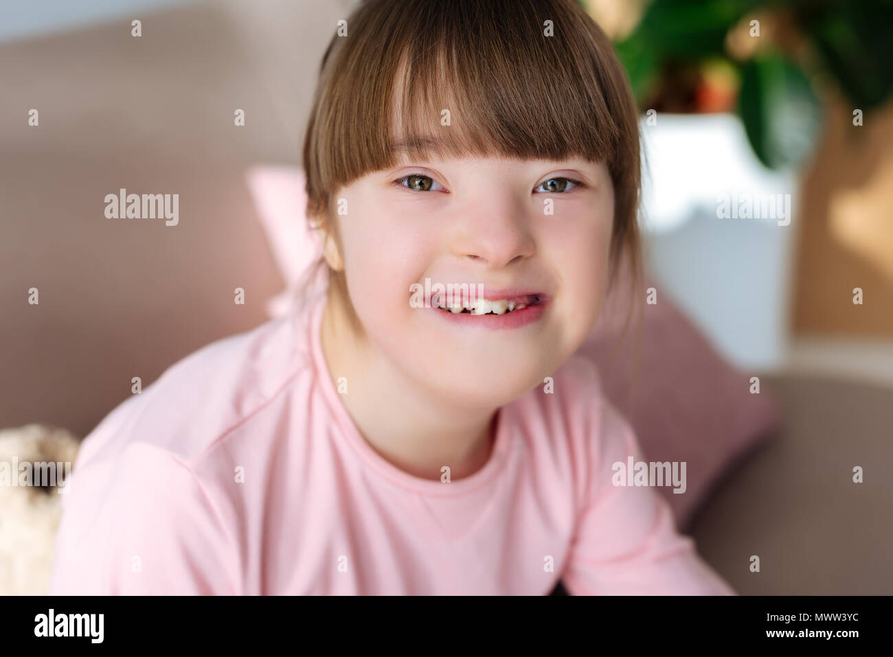 Portrait of happy child with down syndrome Stock Photo