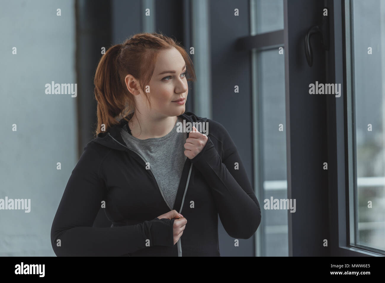 Overweight girl wearing sports clothes in gym Stock Photo Alamy