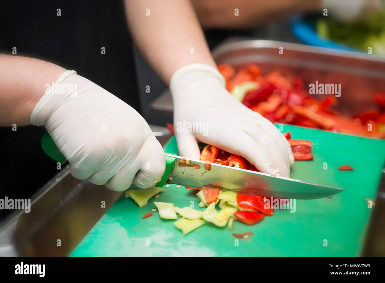 Chopping Peppers For Stew Stock Photo
