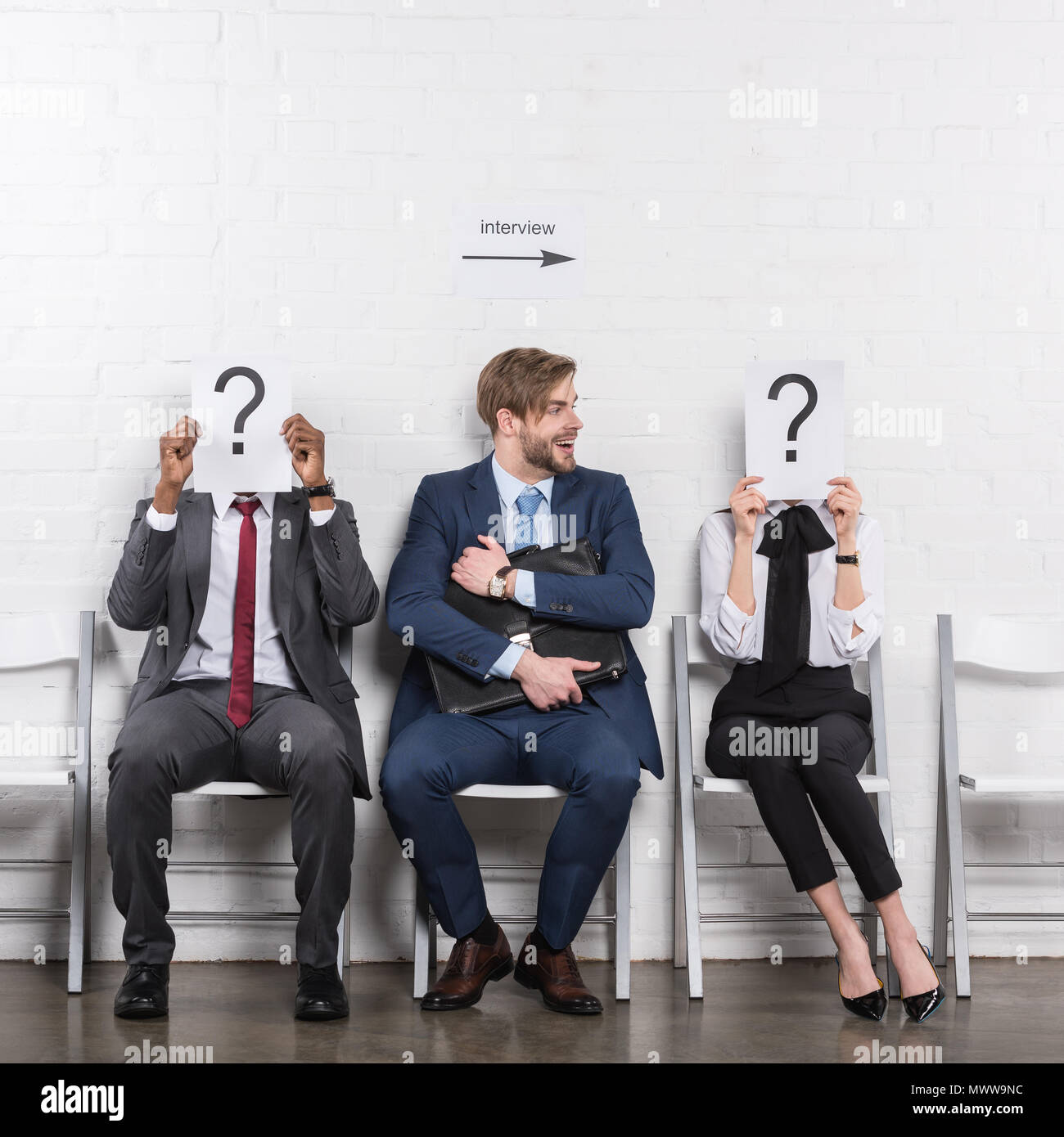 Waiting Questions caucasian businessman and multiethnic business people holding cards ...