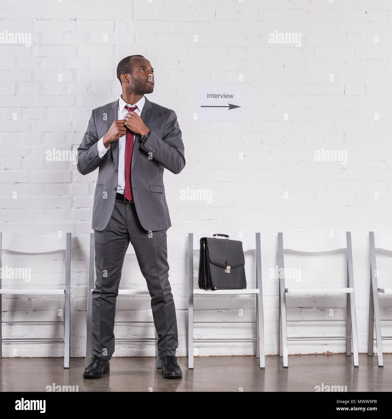 Snapshot of Tying A Tie For A Job At A Bank