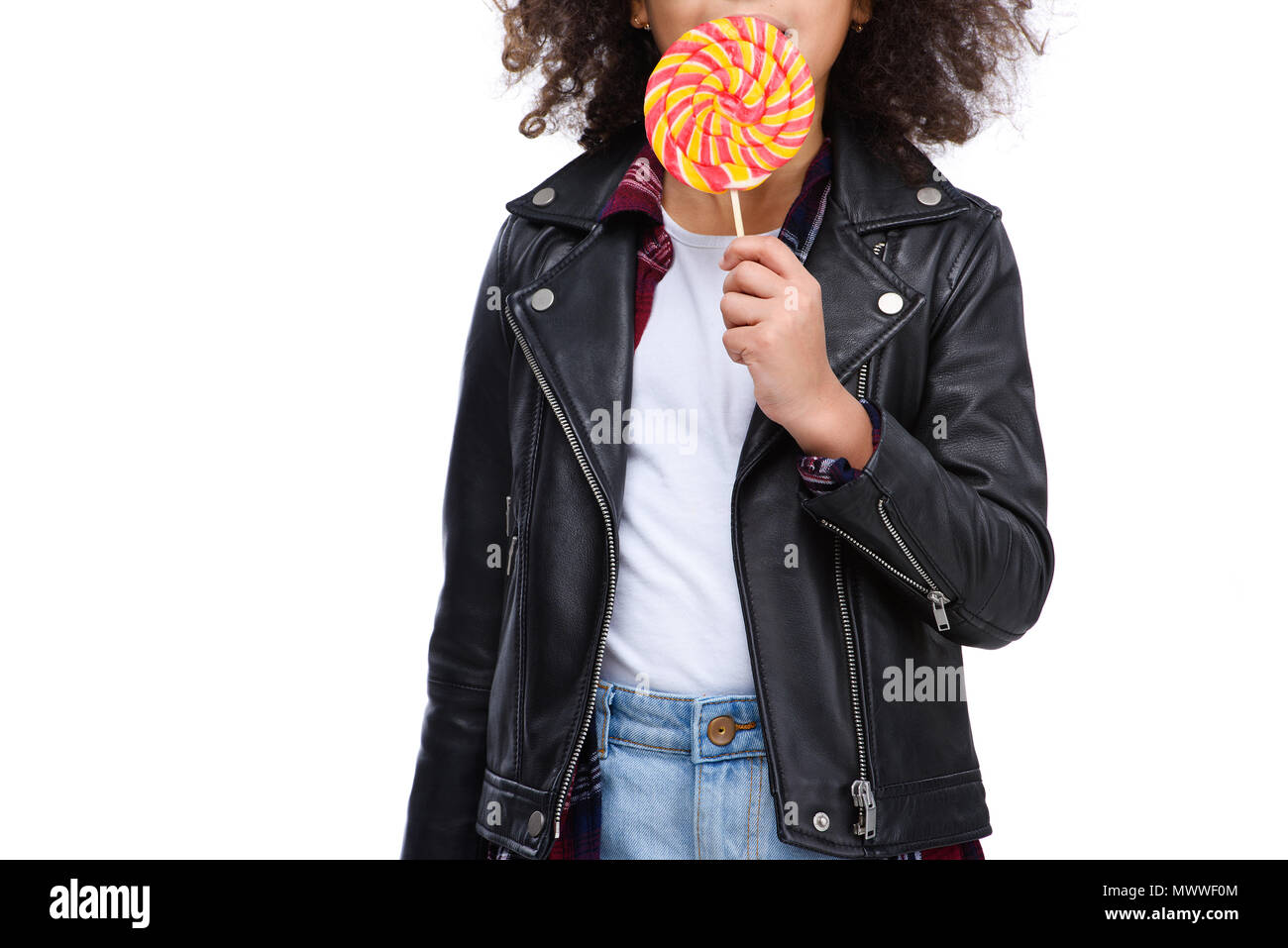 cropped shot of little child eating lollipop isolated on white Stock Photo