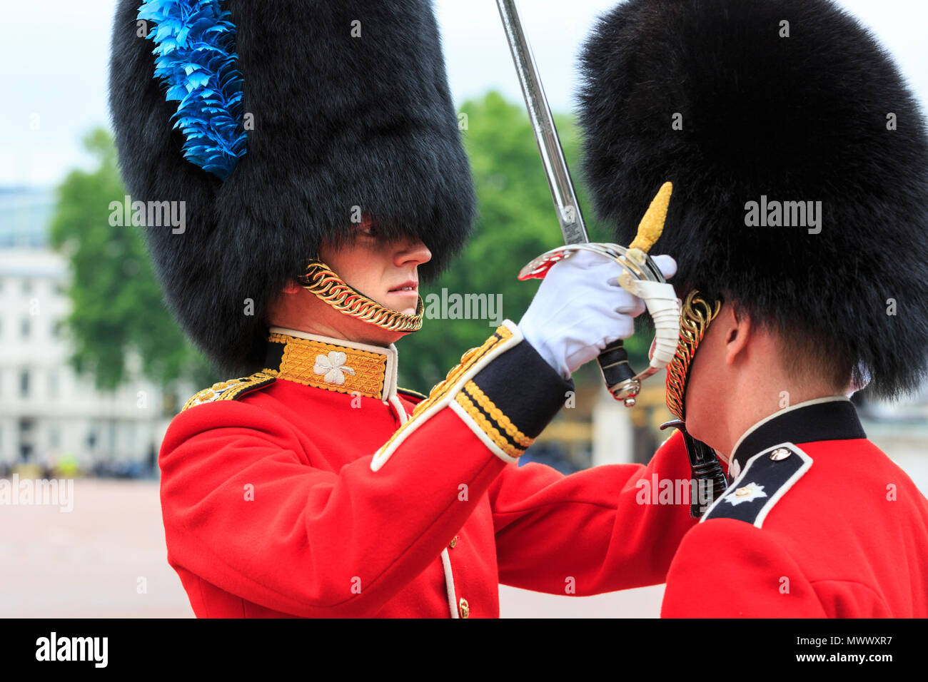 London, UK. 2nd June 2018. A superior inspects one of his soldiers' uniform detail and checks the posture. Londoners and tourists enjoy watching the procession and display of pageantry by troops from the Household Division at The Colonel's Review of Trooping the Colour on the Mall in Westminster. The Colonel's Review is the second and final full public rehearsal of Trooping the Colour, one week before the Queen's Birthday Parade. It takes place along The Mall and at Horse Guards Parade. Credit: Imageplotter News and Sports/Alamy Live News Stock Photo