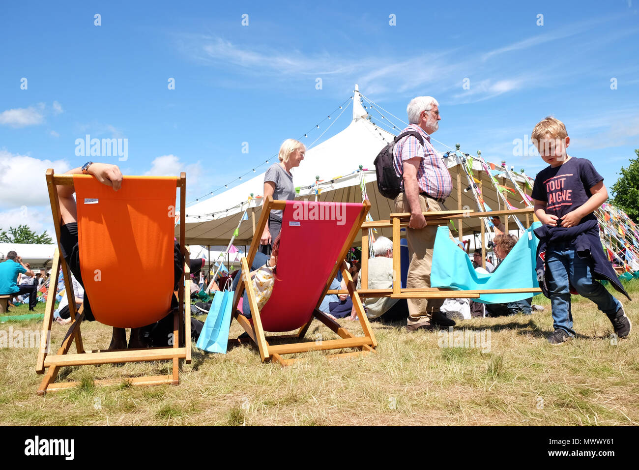 Hay on Wye, UK. 2nd June 2018. Hay Festival. Visitors enjoy the chance to sit and relax in warm sunshine on the Festival lawns between events and sessions with local temperatures of 22c  - The Hay Festival continues to Sunday 3rd June - Photo Steven May / Alamy Live News Stock Photo