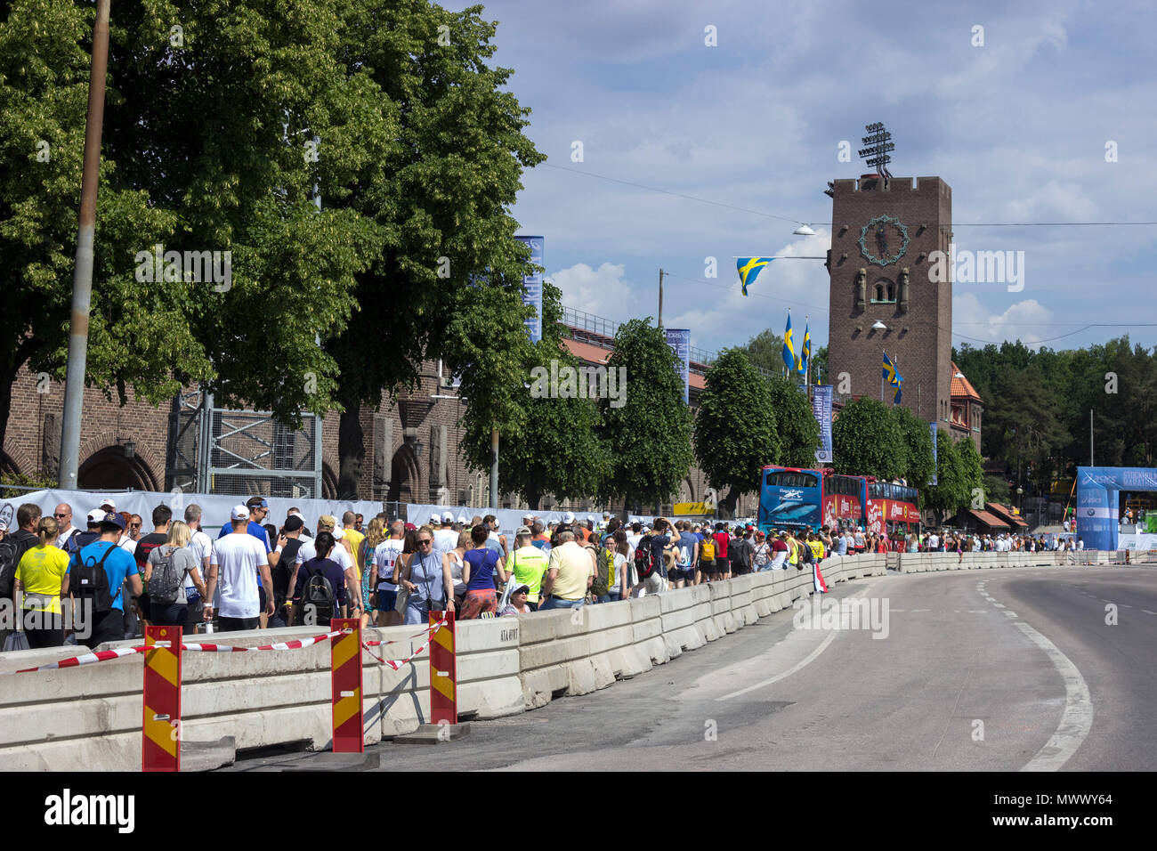 ASICS Stockholm (STHLM) Marathon 2018. Wide angle view of the crowded streets with queuing up participants, at the starting point area, outside of the classical architecture of the Stadion (stadium) building, where the marathon is taking place. The Stadion (stadium) was specially built to host the Olympic Games in 1912.  Stockholm, Sweden. 2nd June 2018. Credit: BasilT/Alamy Live News Stock Photo