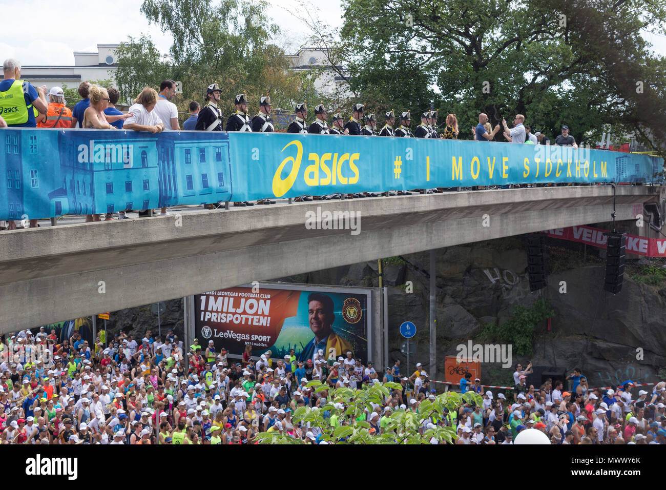 ASICS Stockholm (STHLM) Marathon 2018. Wide view of The musketeers of the  Royal Life guards Infantry of Sweden, on the bridge, waiting for the signal  to fire blank shots and mark the