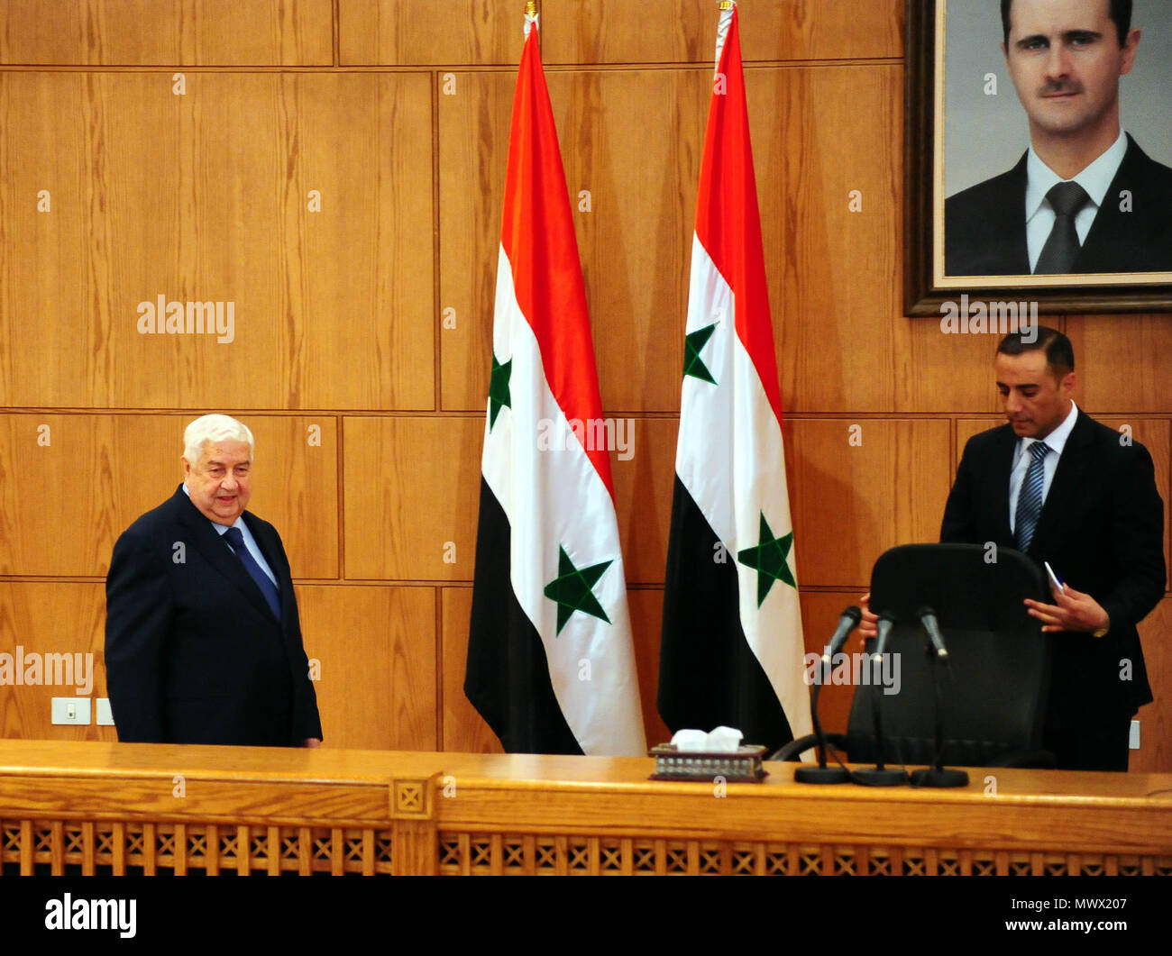 Damascus, Syria. 2nd June, 2018. Syria's Foreign Minister Walid al-Moallem (L) arrives to address a press conference in Damascus, Syria, on June 2, 2018. Walid al-Moallem said on Saturday that the U.S. should withdraw from the al-Tanf base in southeastern Syria ahead of any agreement reached in the south of the country. Credit: Ammar Safarjalani/Xinhua/Alamy Live News Stock Photo