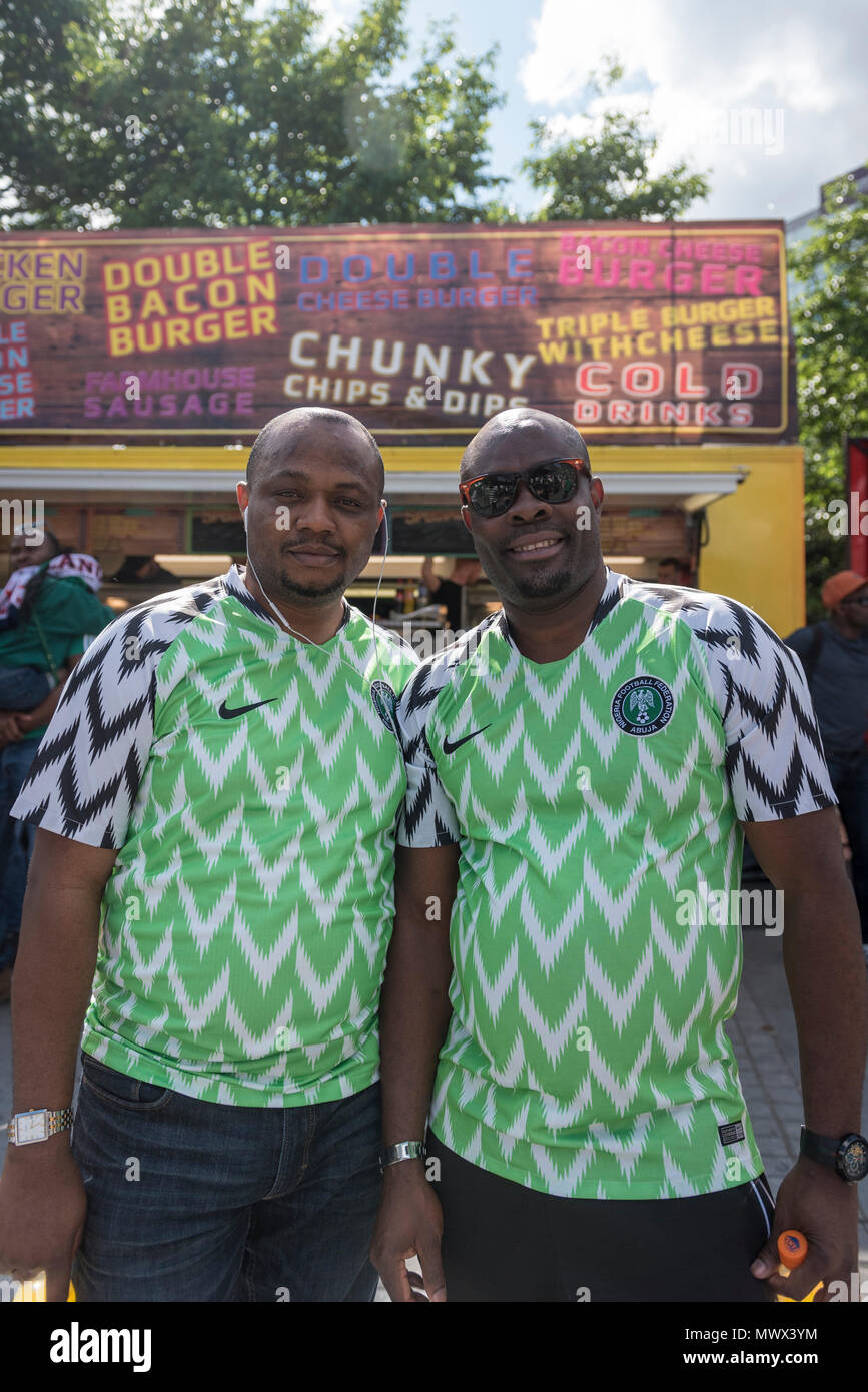 London, UK.  2 June 2018.  Nigerian fans wear the country's latest replica shirt, which bears a feathered pattern referencing the Nigerian team which made its debut in the 1994 World Cup.  3 million replica shirts have sold on pre-order alone with others selling out in minutes online. Fans arrive for the friendly football match between England and Nigeria at Wembley Stadium, the final match at Wembley before England travel to the World Cup in Russia  Credit: Stephen Chung / Alamy Live News Stock Photo