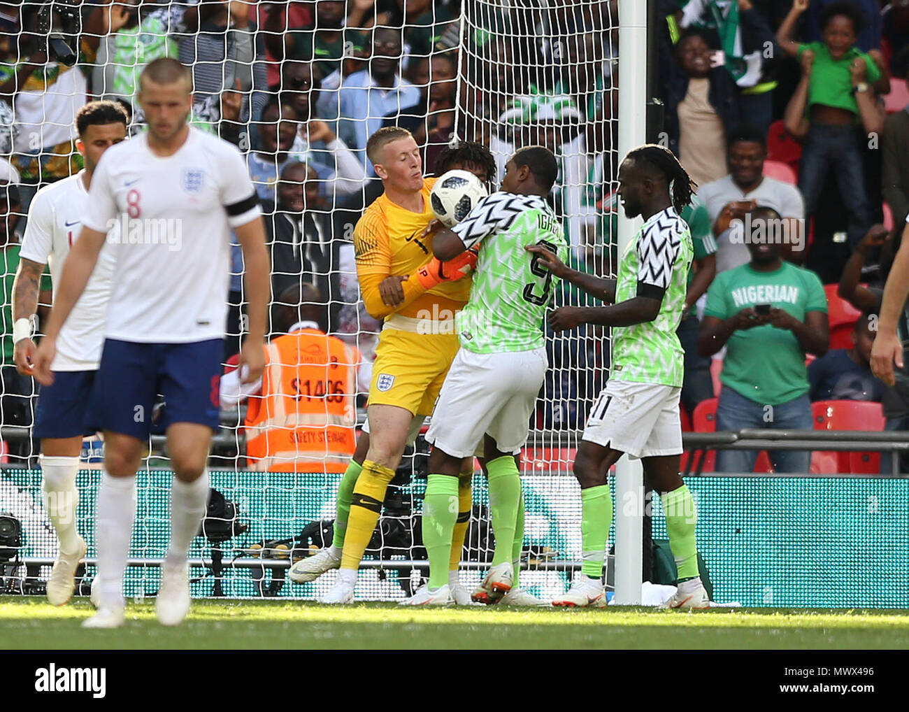 London, UK. Wembley Stadium, London, UK. 2nd June, 2018. International football friendly, England versus Nigeria; Odion Ighalo, Victor Moses and Alex Iwobi of Nigeria try to wrestle the ball from Goalkeeper Jordan Pickford of England after Alex Iwobi scored his sides 1st goal in the 47th minute to make it 2-1 Credit: Action Plus Sports/Alamy Live News Credit: Action Plus Sports Images/Alamy Live News Stock Photo