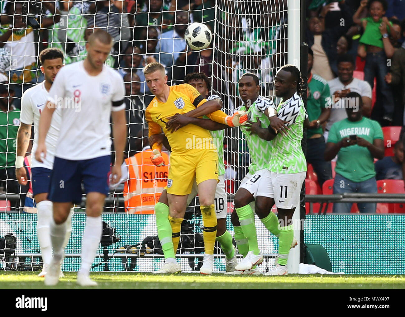 London, UK. Wembley Stadium, London, UK. 2nd June, 2018. International football friendly, England versus Nigeria; Odion Ighalo, Victor Moses and Alex Iwobi of Nigeria try to wrestle the ball from Goalkeeper Jordan Pickford of England after Alex Iwobi scored his sides 1st goal in the 47th minute to make it 2-1 Credit: Action Plus Sports/Alamy Live News Credit: Action Plus Sports Images/Alamy Live News Stock Photo