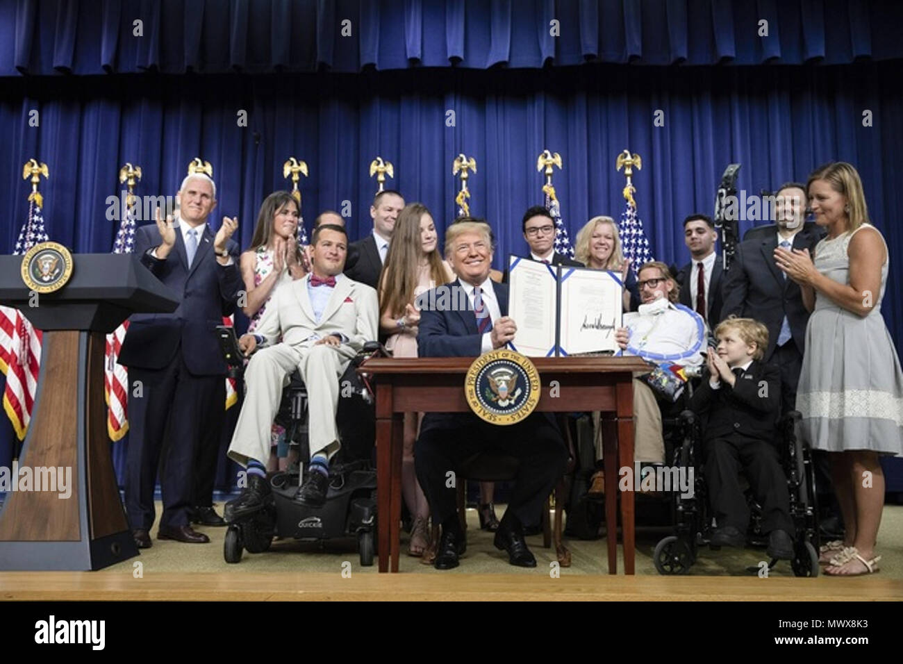 WASHINGTON, DC - WEEK OF MAY 28: President Donald J. Trump, joined by Vice President Mike Pence, signs S. 204 the “Right to Try Act,” Wednesday, May 30, 2018, in the South Court Auditorium in the Eisenhower Executive Office Building at the White House in Washington, D.C. The legislation, introduced by U.S. Senator Ron Johnson, R-WI, will allow seriously ill patients in all 50 states to request access to experimental medicines without FDA approval.  People:  President Donald J. Trump, Vice President Mike Pence Stock Photo