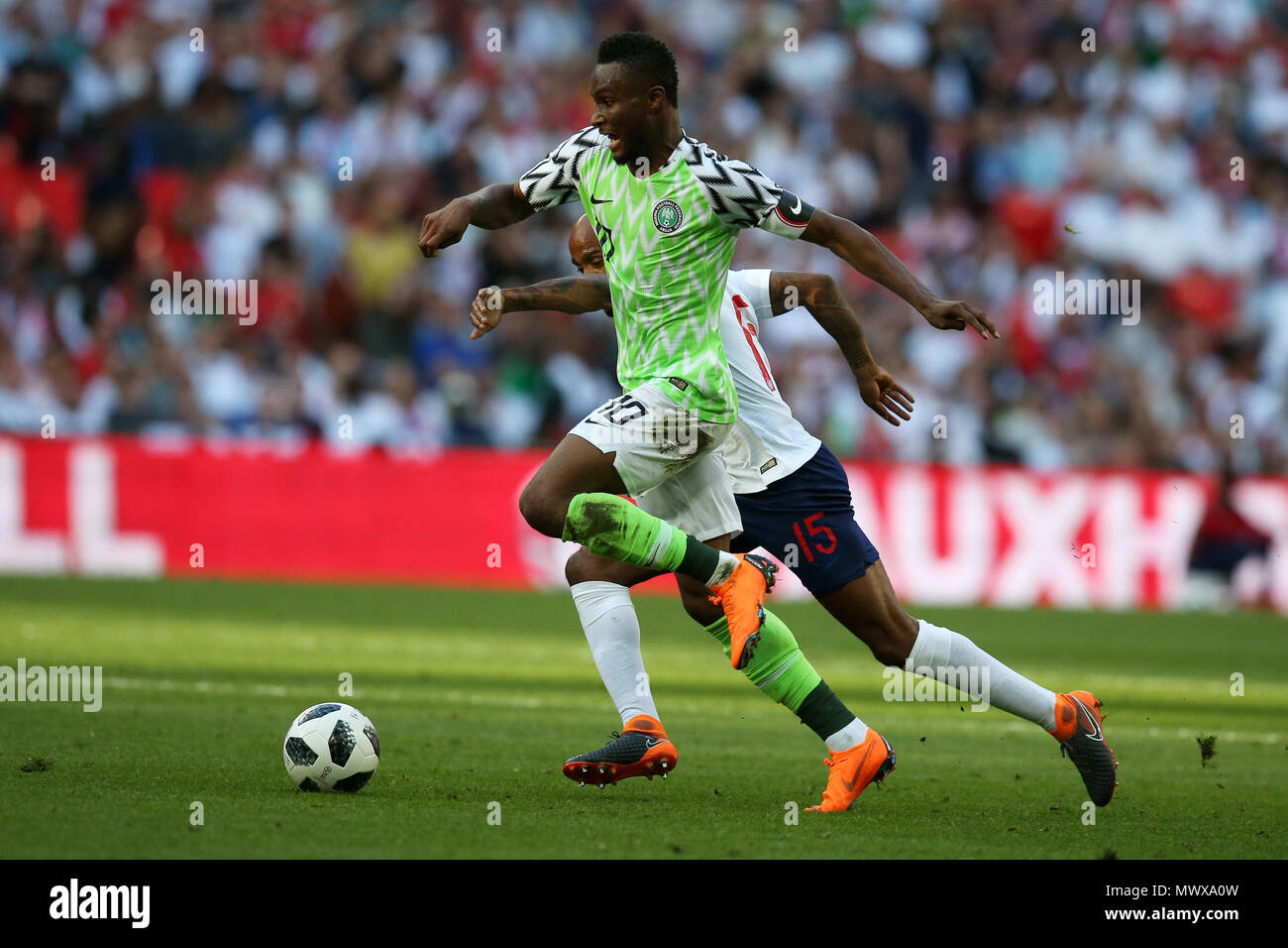 Wembley Stadium, London, UK. 2nd Jun, 2018. John Obi Mikel of Nigeria runs past Fabian Delph of England. Football International friendly, England v Nigeria at Wembley Stadium in London on Saturday 2nd June 2018.  this image may only be used for Editorial purposes. Editorial use only, license required for commercial use. No use in betting, games or a single club/league/player publications. pic by Andrew Orchard//Andrew Orchard sports photography/Alamy Live news Stock Photo