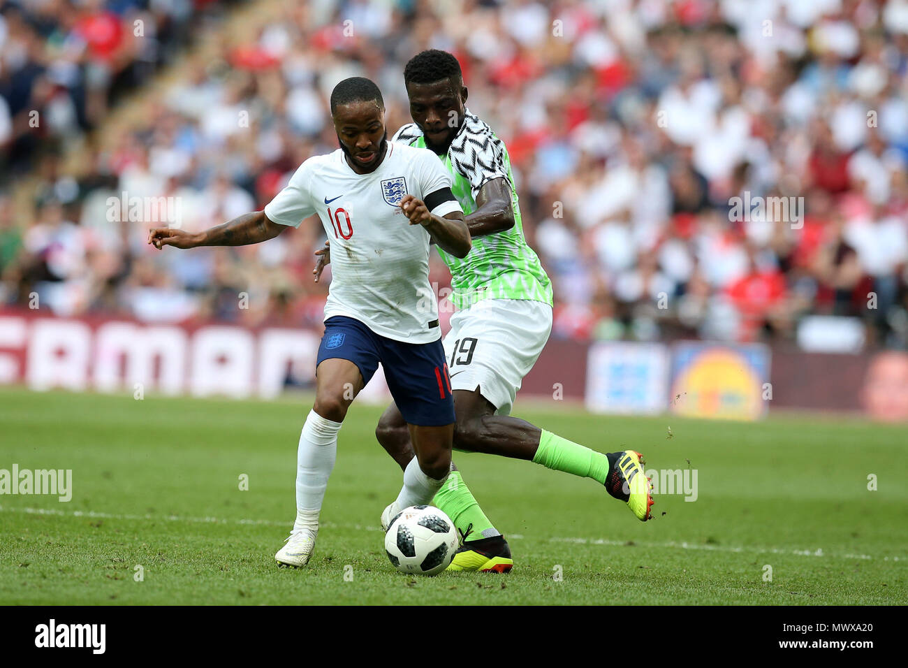 Wembley Stadium, London, UK. 2nd Jun, 2018. Raheem Sterling of England and John Ogu of Nigeria in action  .Football International friendly, England v Nigeria at Wembley Stadium in London on Saturday 2nd June 2018.  this image may only be used for Editorial purposes. Editorial use only, license required for commercial use. No use in betting, games or a single club/league/player publications. pic by Andrew Orchard//Andrew Orchard sports photography/Alamy Live news Stock Photo