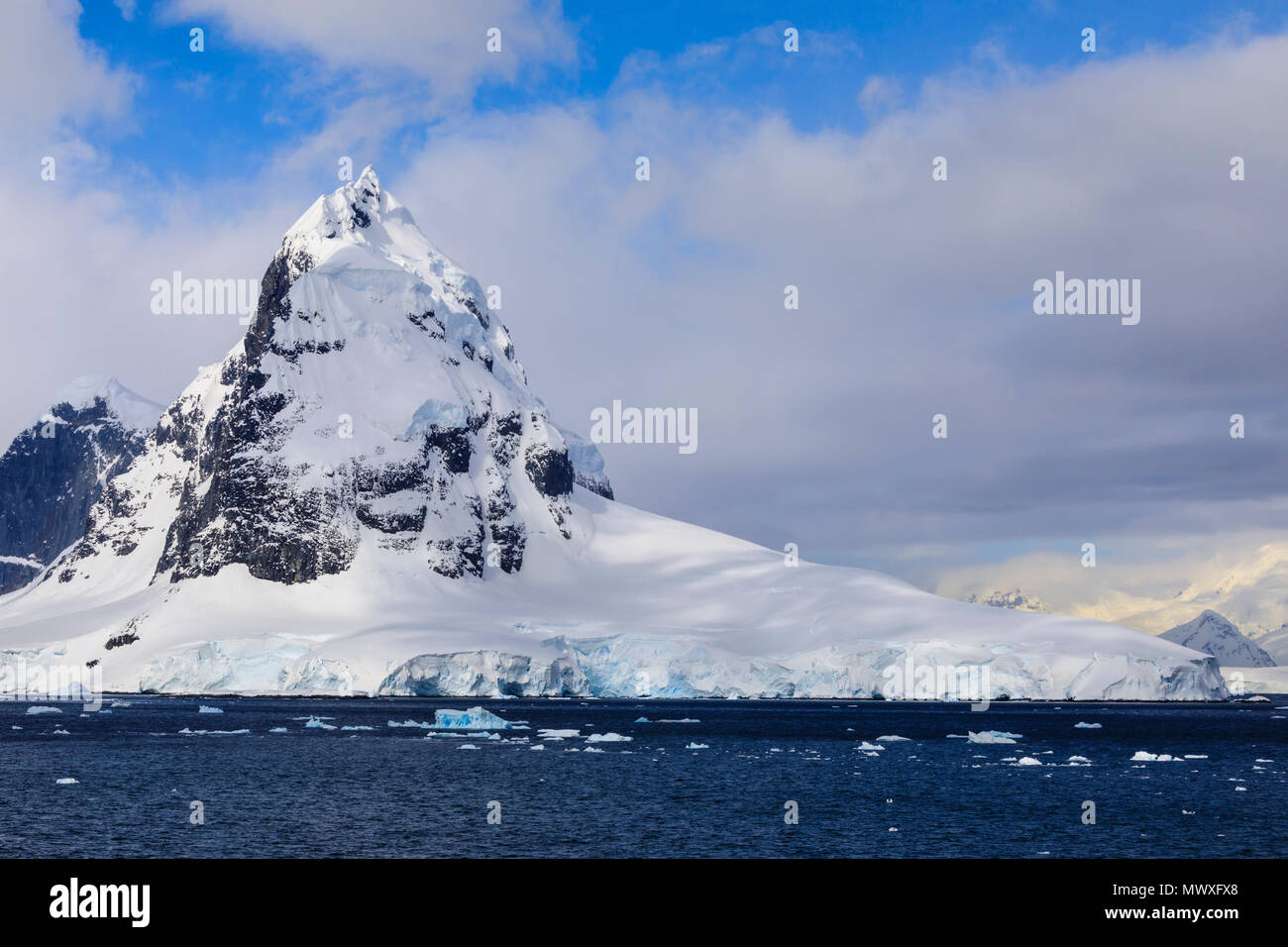 Mountains and glaciers of Cape Errera with blue sky, Wiencke Island, from Bismarck Strait, Antarctic Peninsula, Antarctica, Polar Regions Stock Photo