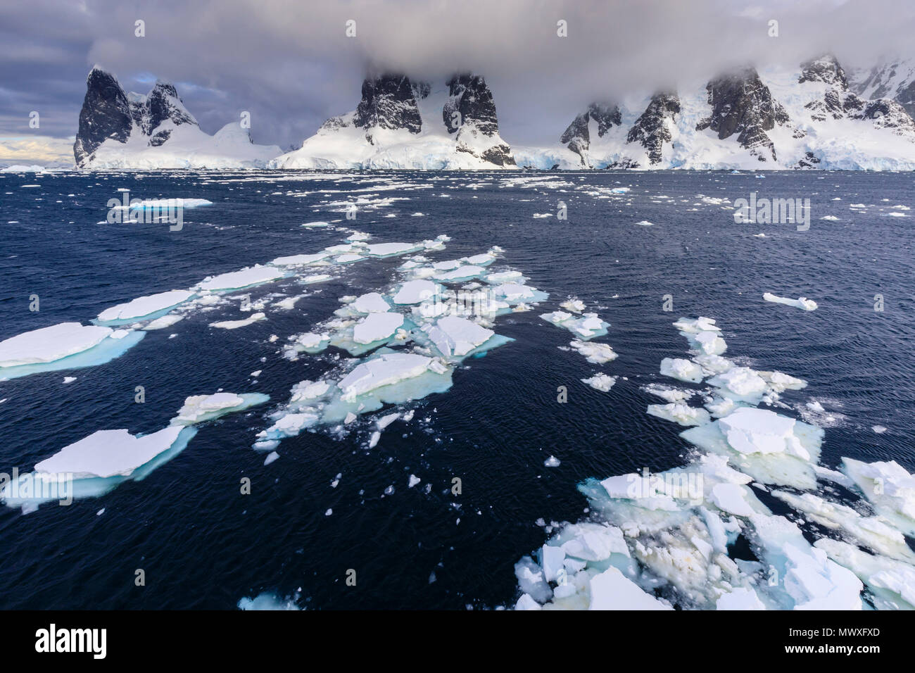 Sea ice off Una Peaks and False Cape Renard, Lemaire Channel entrance, Antarctic Peninsula, Antarctica, Polar Regions Stock Photo