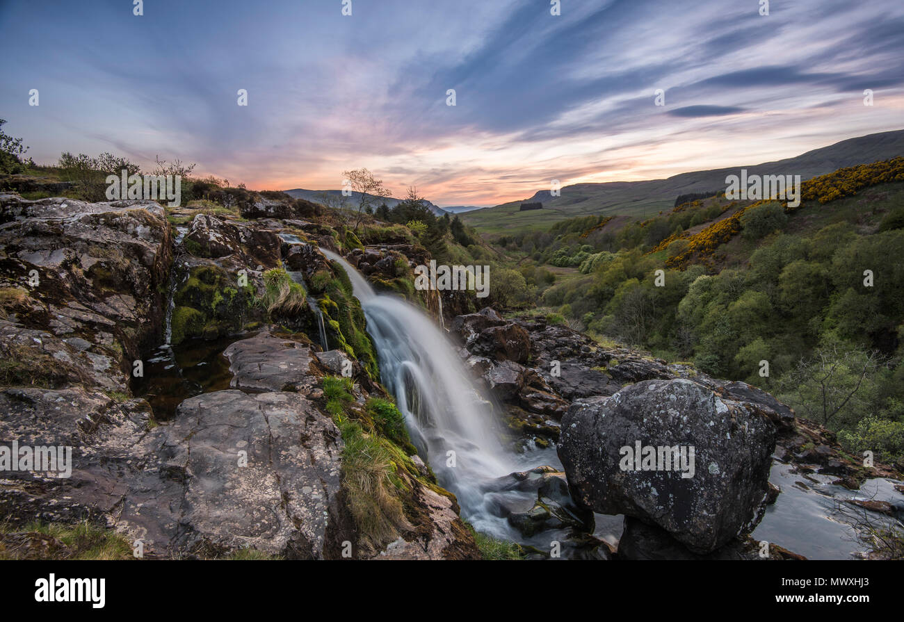Sunset at the Loup o Fintry waterfall near the village of Fintry, Stirlingshire, Scotland, United Kingdom, Europe Stock Photo