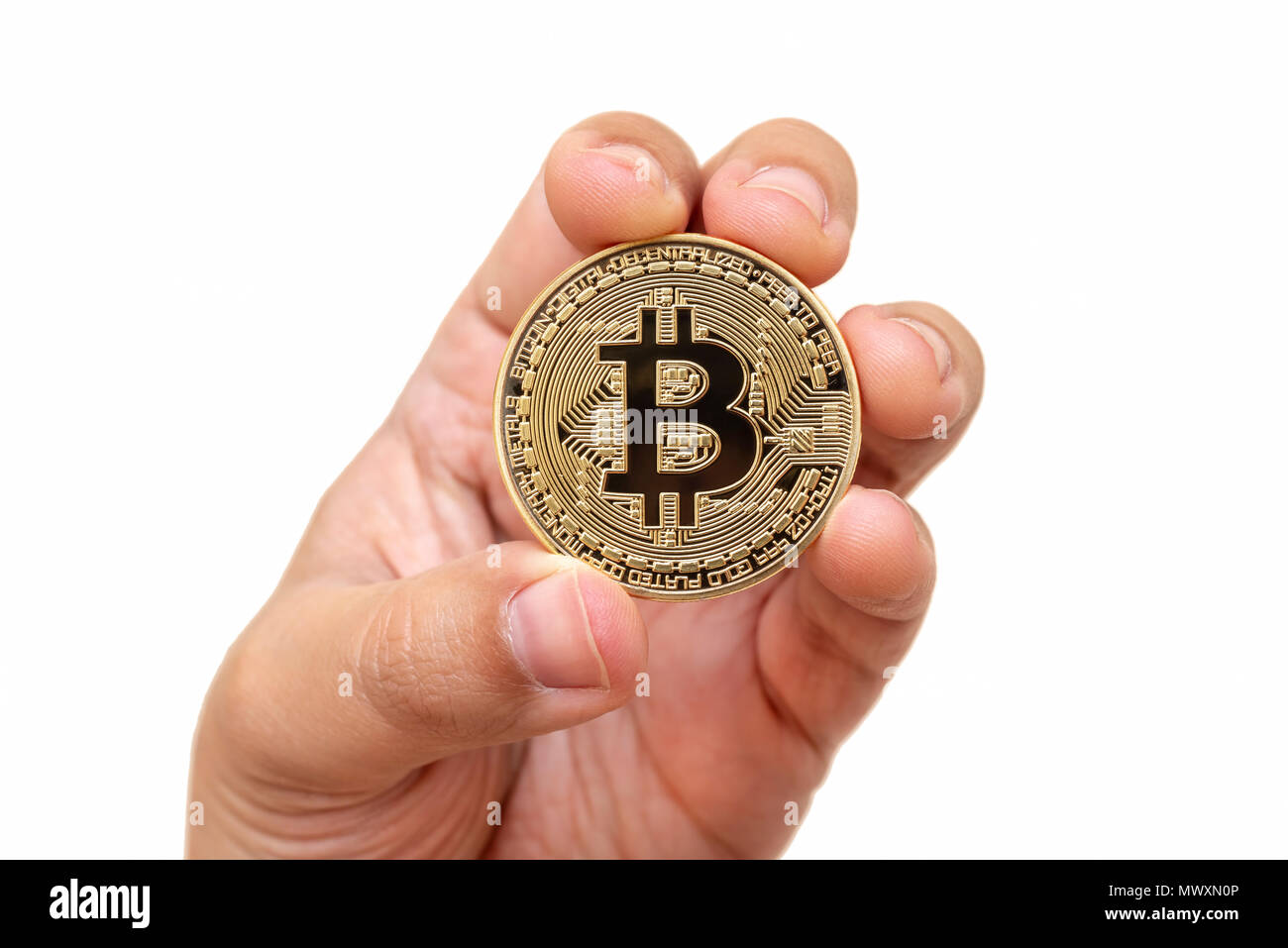 Hand Holding Physical Bitcoin Isolated On White Background Stock Photo