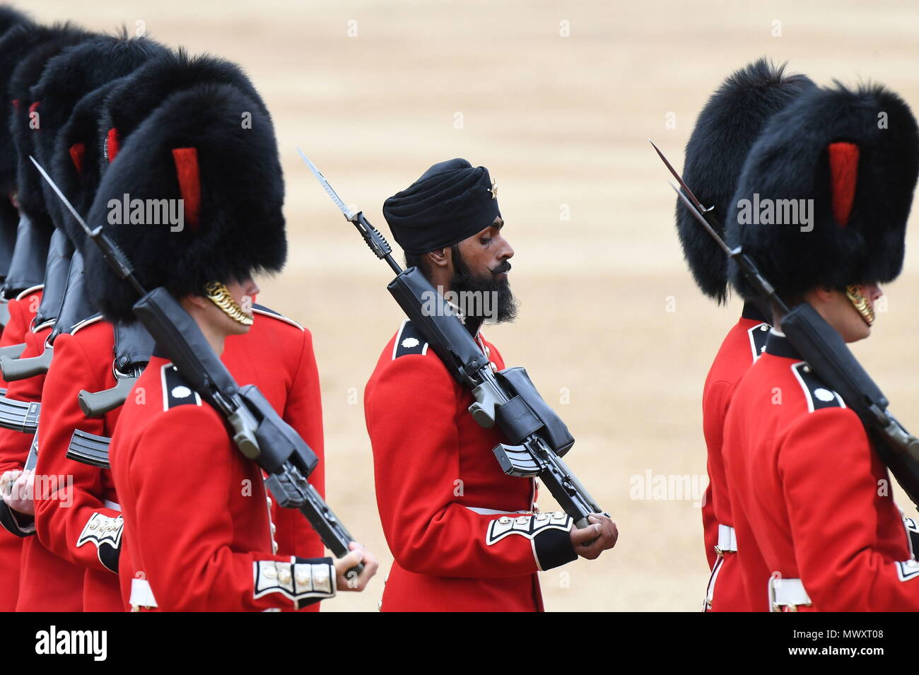 A Sikh member of the Coldstream Guards wearing a turban as he takes part in the Colonel's Review, the final rehearsal for Trooping the Colour, the Queen's annual birthday parade, in Central London. Stock Photo