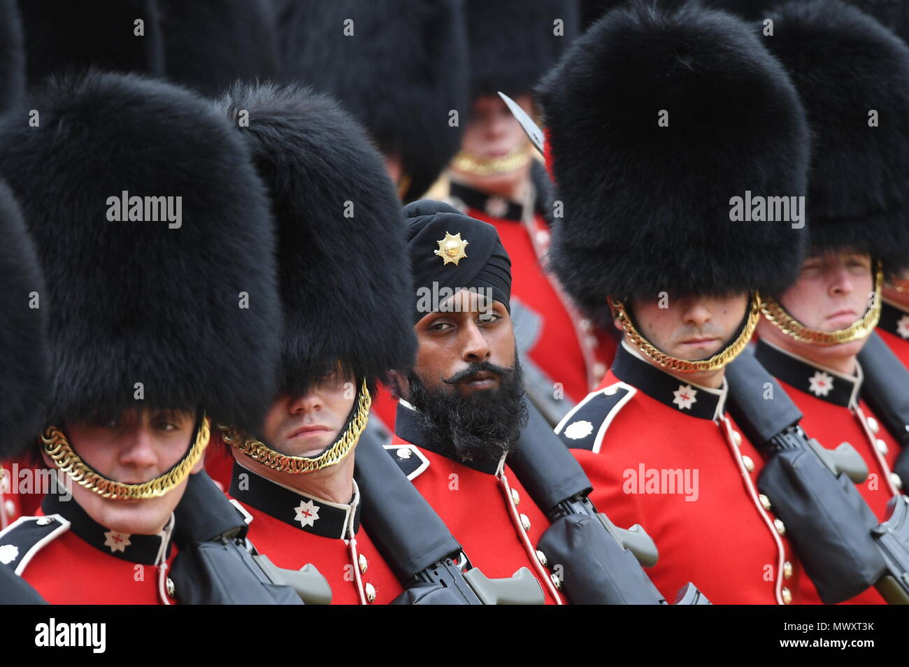 A Sikh member of the Coldstream Guards wearing a turban as he takes part in the Colonel's Review, the final rehearsal for Trooping the Colour, the Queen's annual birthday parade, in central London. Stock Photo