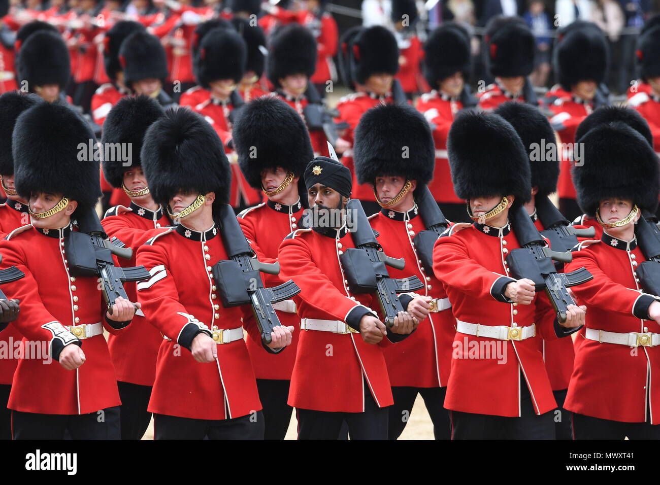 A Sikh member of the Coldstream Guards wearing a turban as he takes part in the Colonel's Review, the final rehearsal for Trooping the Colour, the Queen's annual birthday parade, in central London. Stock Photo