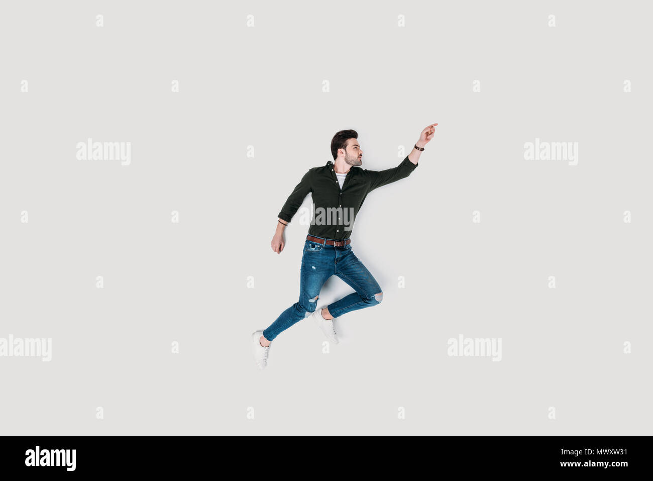 top view of handsome young man jumping isolated on white Stock Photo