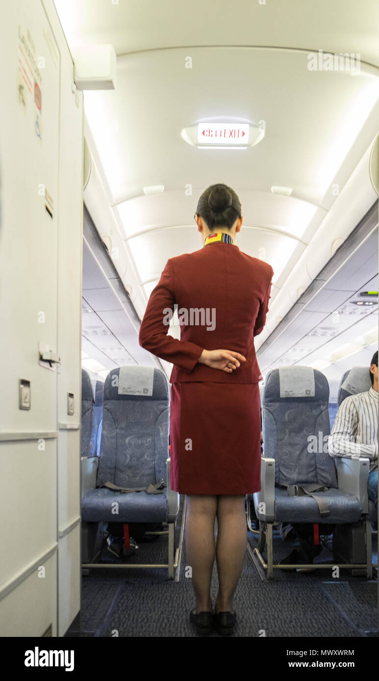 Air China,air,stewardess,crew,staff,interior,flight,safety,check,at,Beijing Airport,Peoples Republic of China,PRK,China,Chinese,Asia,prior,to flight, Stock Photo