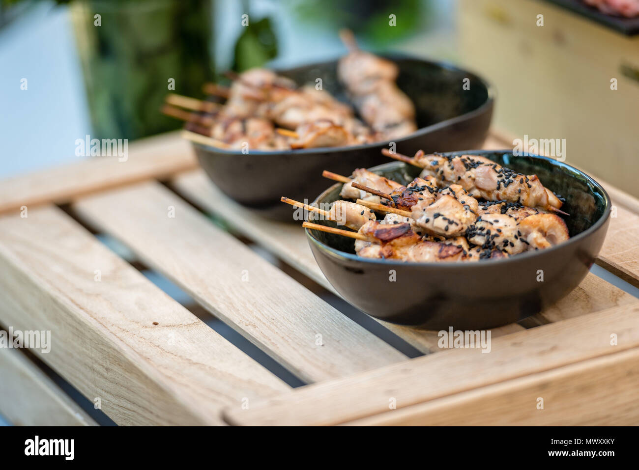 Marinated pink red raw beef meat kebabs on wooden sticks Stock Photo