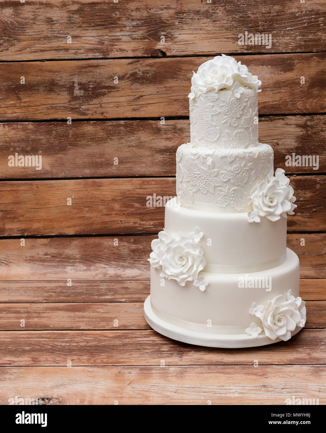 Four tier white wedding cake Stock Photo