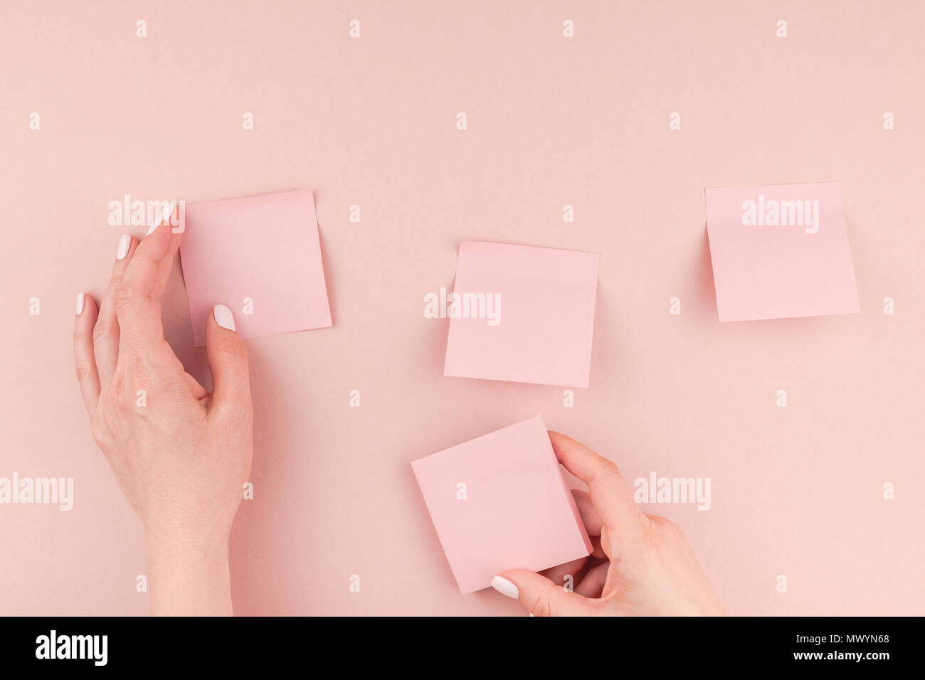 Creative flat lay photo of workspace desk with millennial pink sticker paper post it mock up in