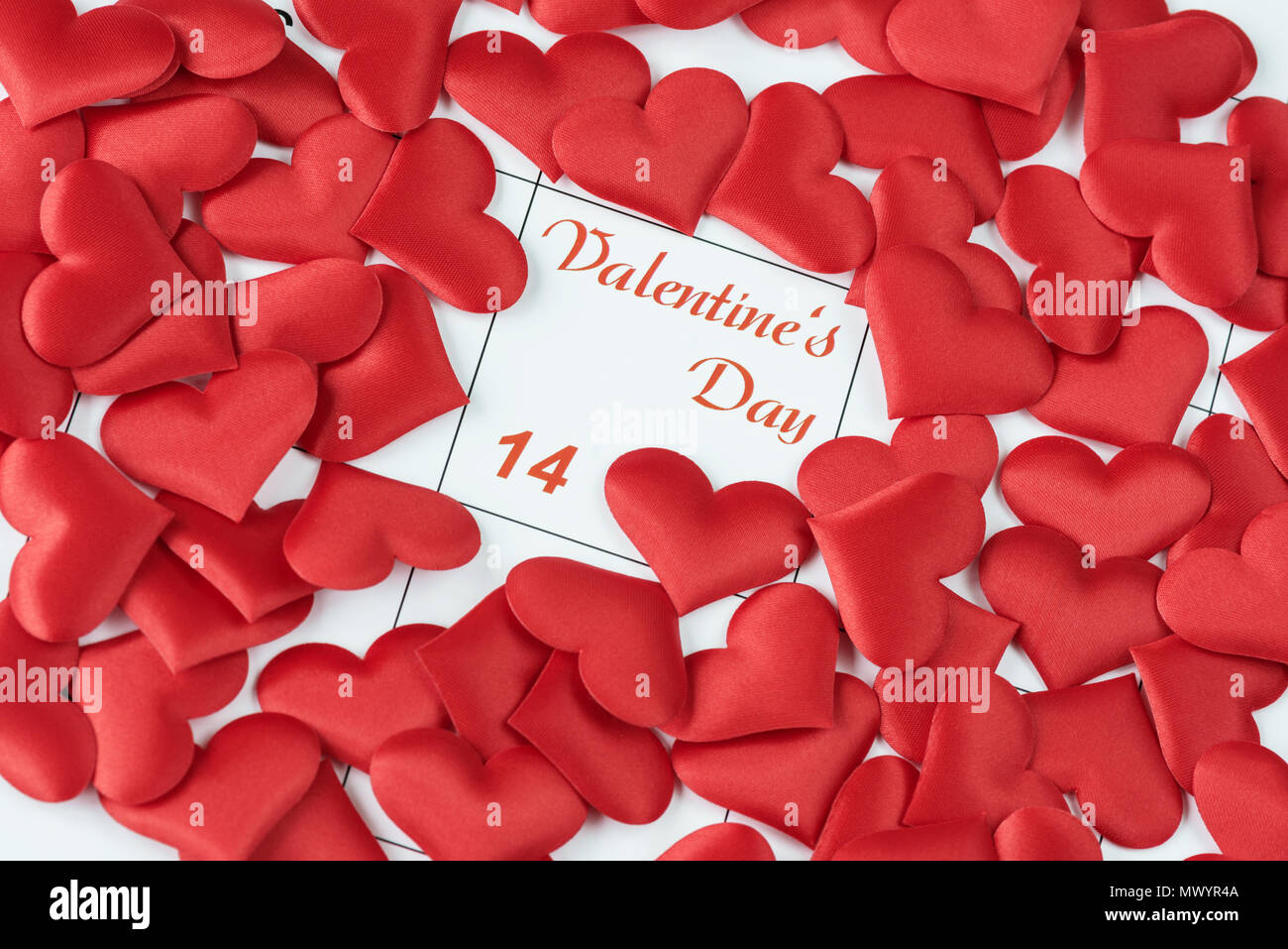 Many red silk hearts on the calendarwith the inscription Valentine's Day. Background for a greeting card for Saint Valentine's Day ore wallpaper Stock Photo - Alamy Many red silk hearts on the calendarwith the inscription Valentine's Day. Background for a greeting card for Saint Valentine's Day ore wallpaper Stock Photo - Alamy