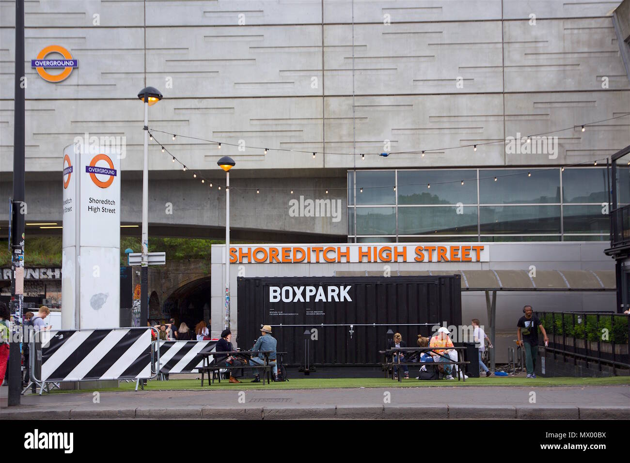 Shoreditch High street showing Boxpark Shoredtich and the sign for the overground station Stock Photo