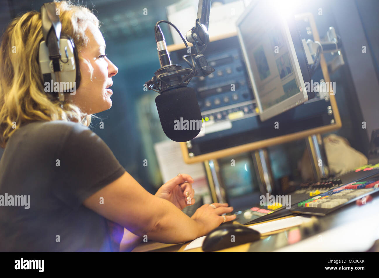 White British female radio DJ inside recording studio at work Stock Photo -  Alamy