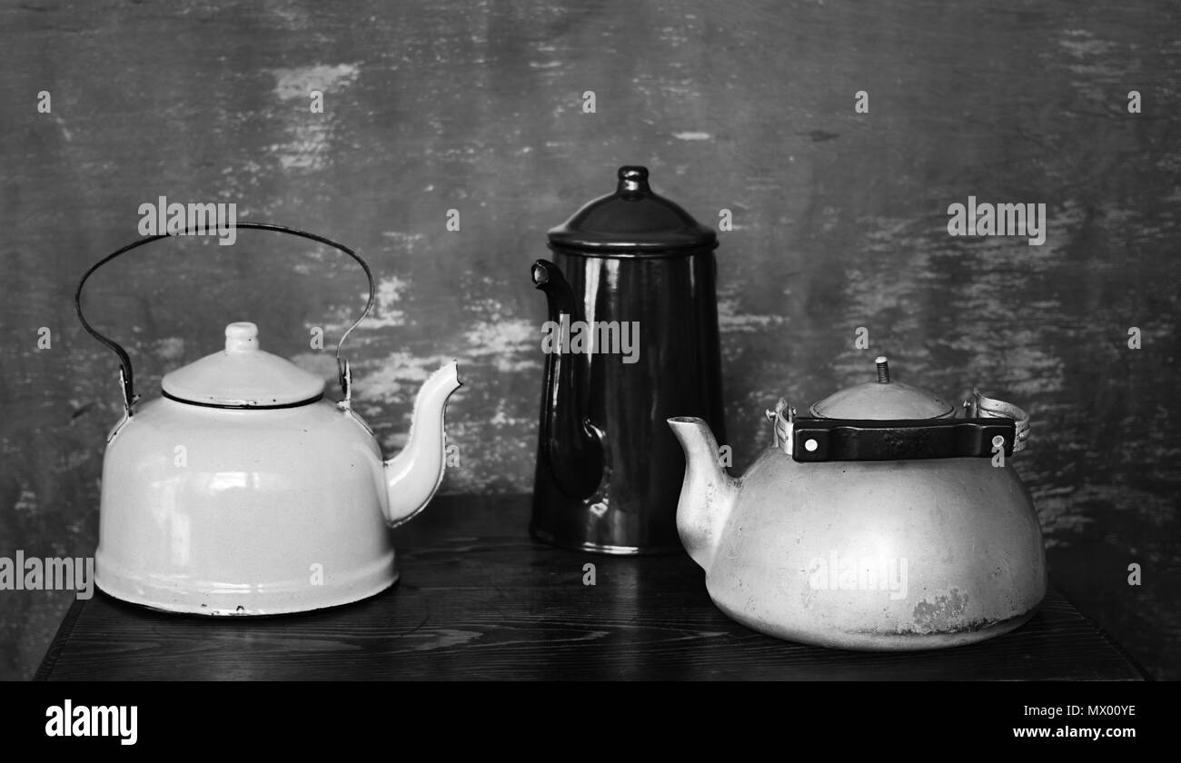 Two vintage kettles and coffee pot. Black and white Stock Photo