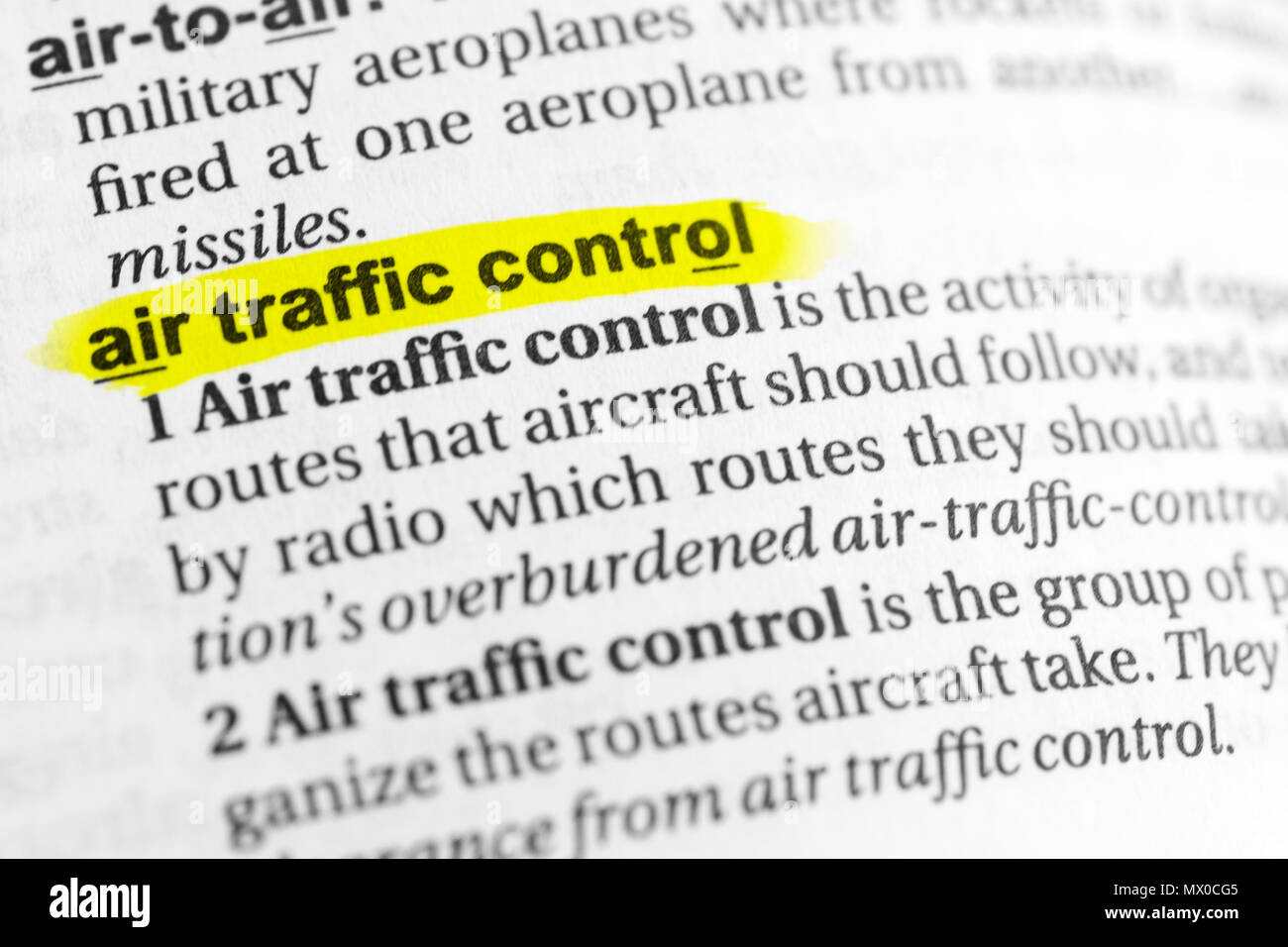 Highlighted English word "air traffic control" and its definition in the dictionary Stock Photo