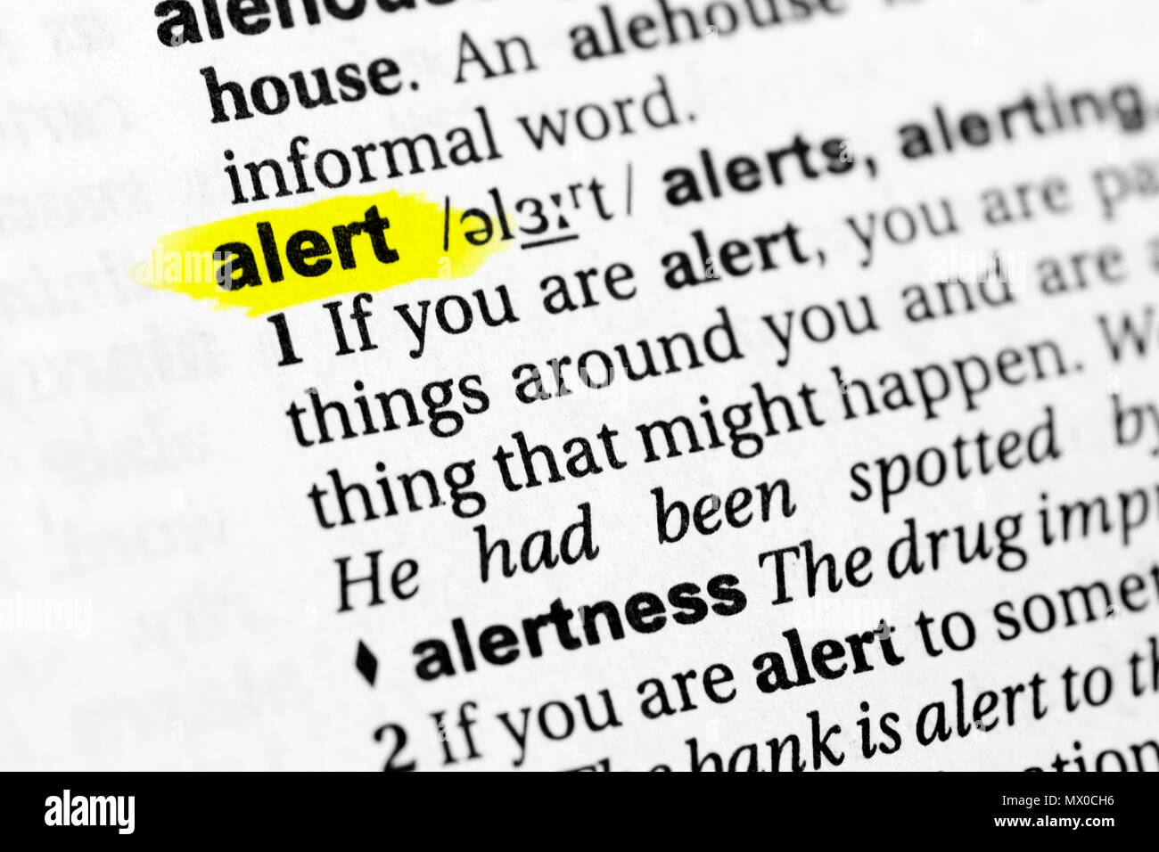 Highlighted English word "alert" and its definition in the dictionary