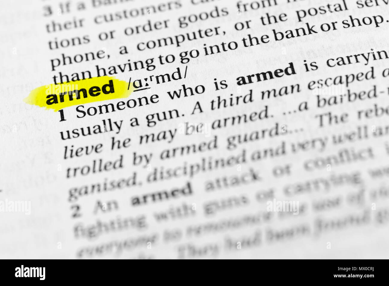 Highlighted English word "armed" and its definition in the dictionary