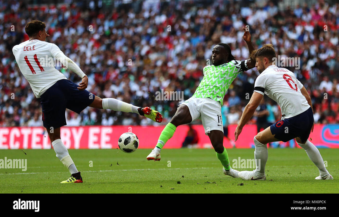 England's (left-right) Dele Alli, Nigeria's Victor Moses and England's Gary Cahill battle for the ball during the International Friendly match at WembleyÂ Stadium, London. Stock Photo