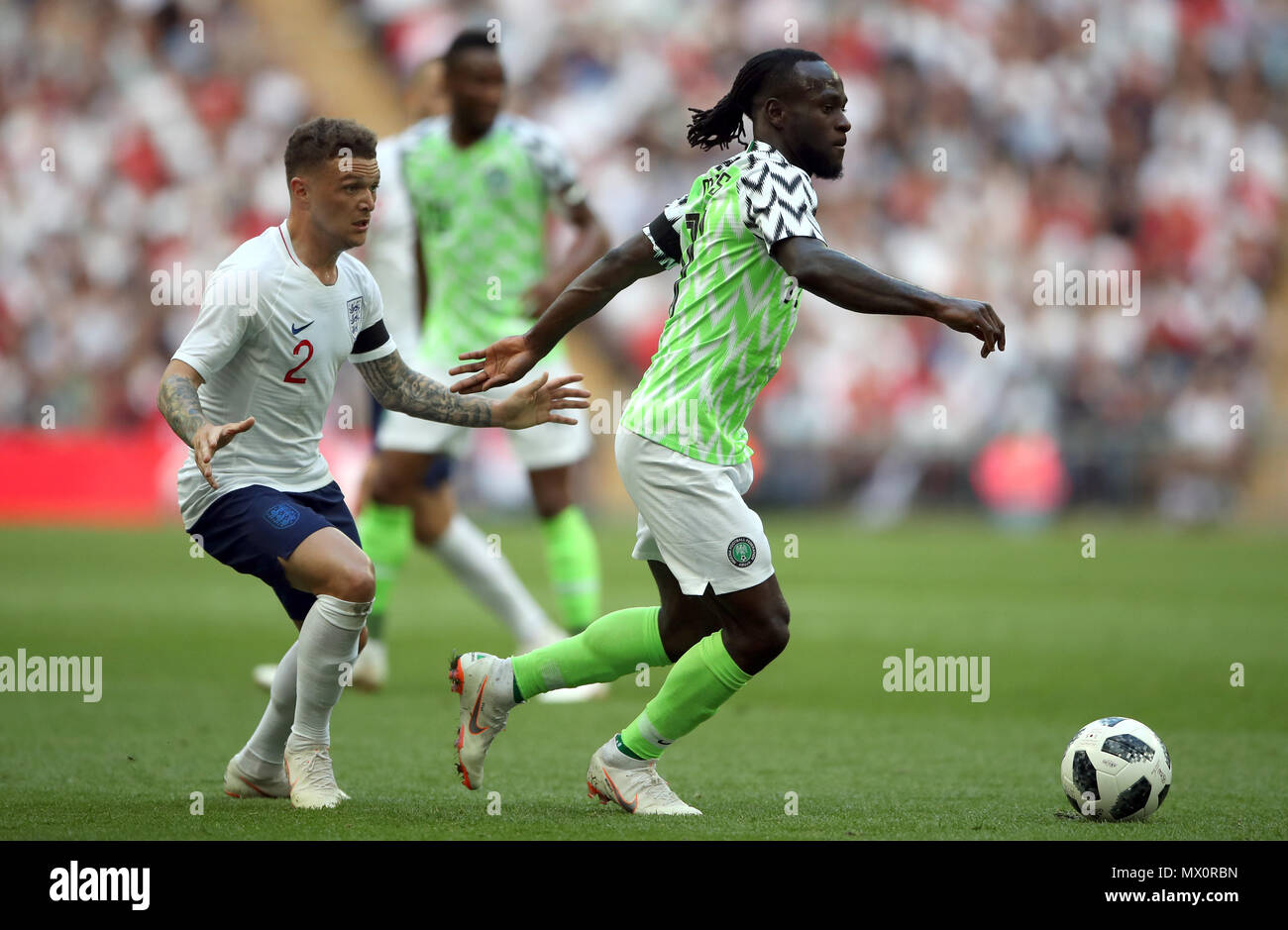 England's Kieran Trippier (left) and Nigeria's Victor Moses battle for the ball during the International Friendly match at Wembley Stadium, London. Stock Photo