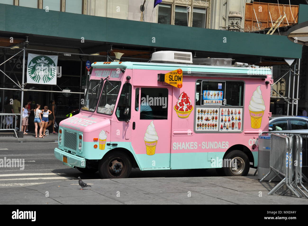 Pink and blue Ice Cream Truck on streets of New York, US Stock Photo