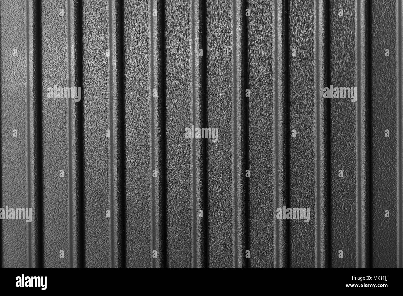 ribbed cast iron surface, metal texture, textured black background ...