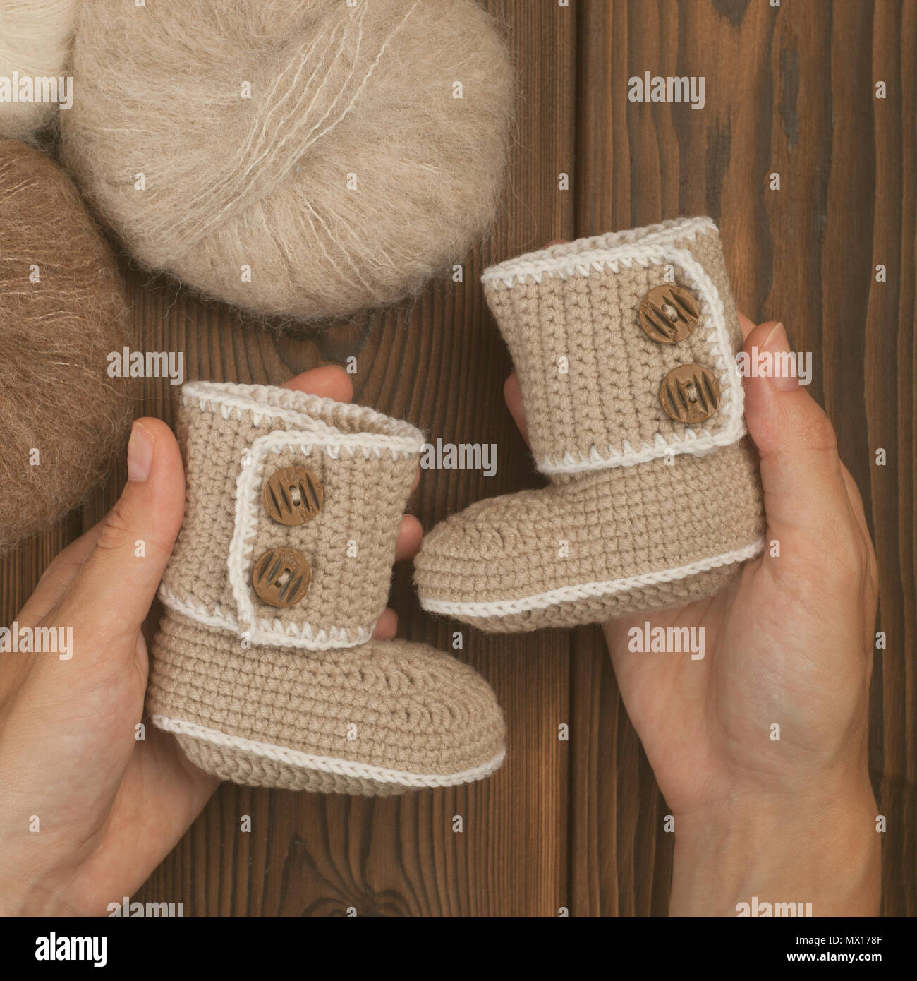 Baby Booties For Newborn Baby In Mother Hands Pregnant Girl With
