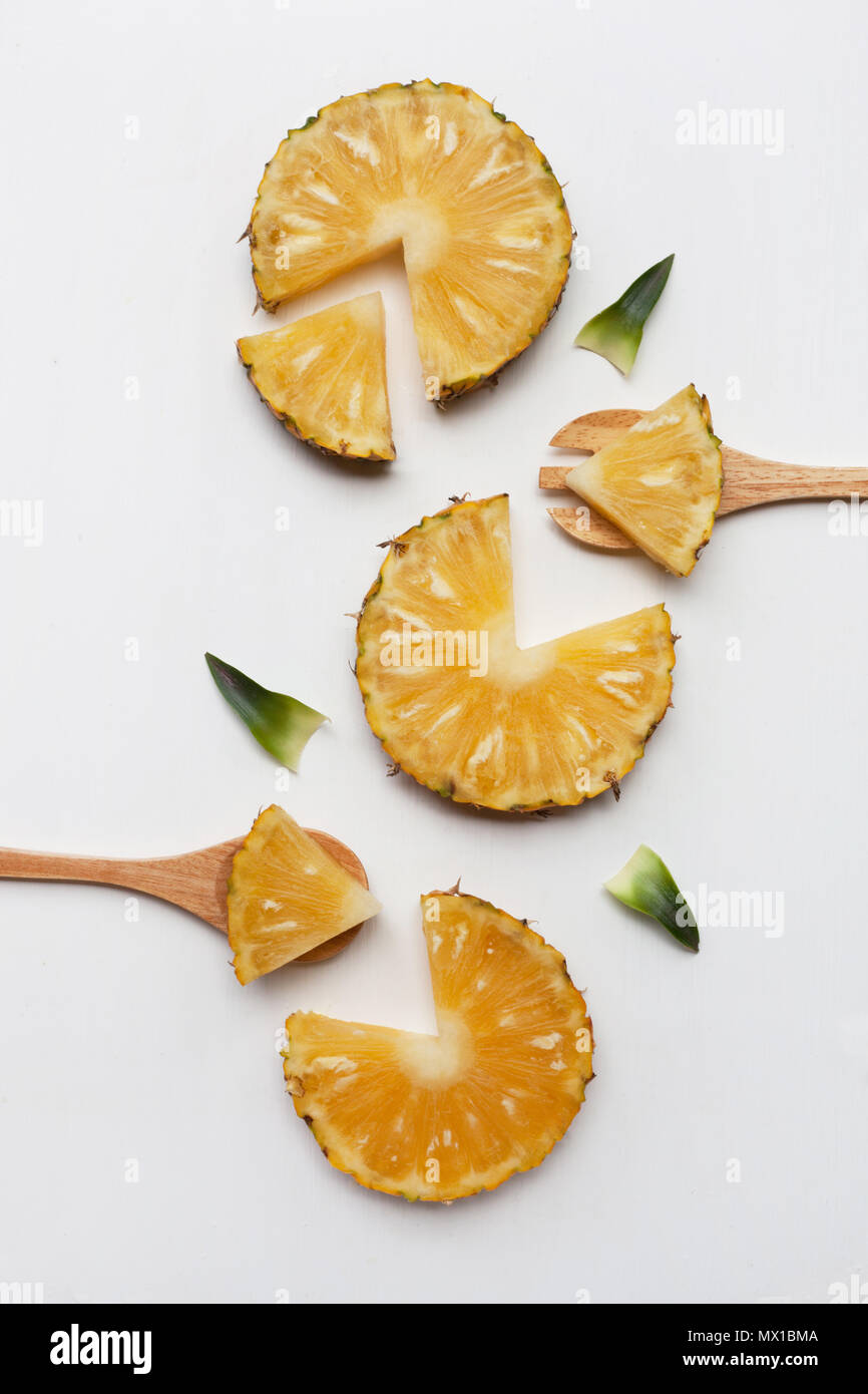 Slices of pineapple with leaf isolated on white background Stock Photo ...