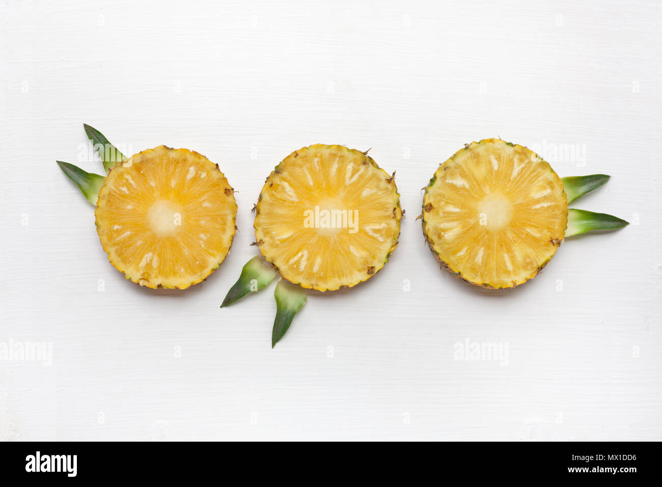 Slices of pineapple with leaf isolated on white background Stock Photo ...