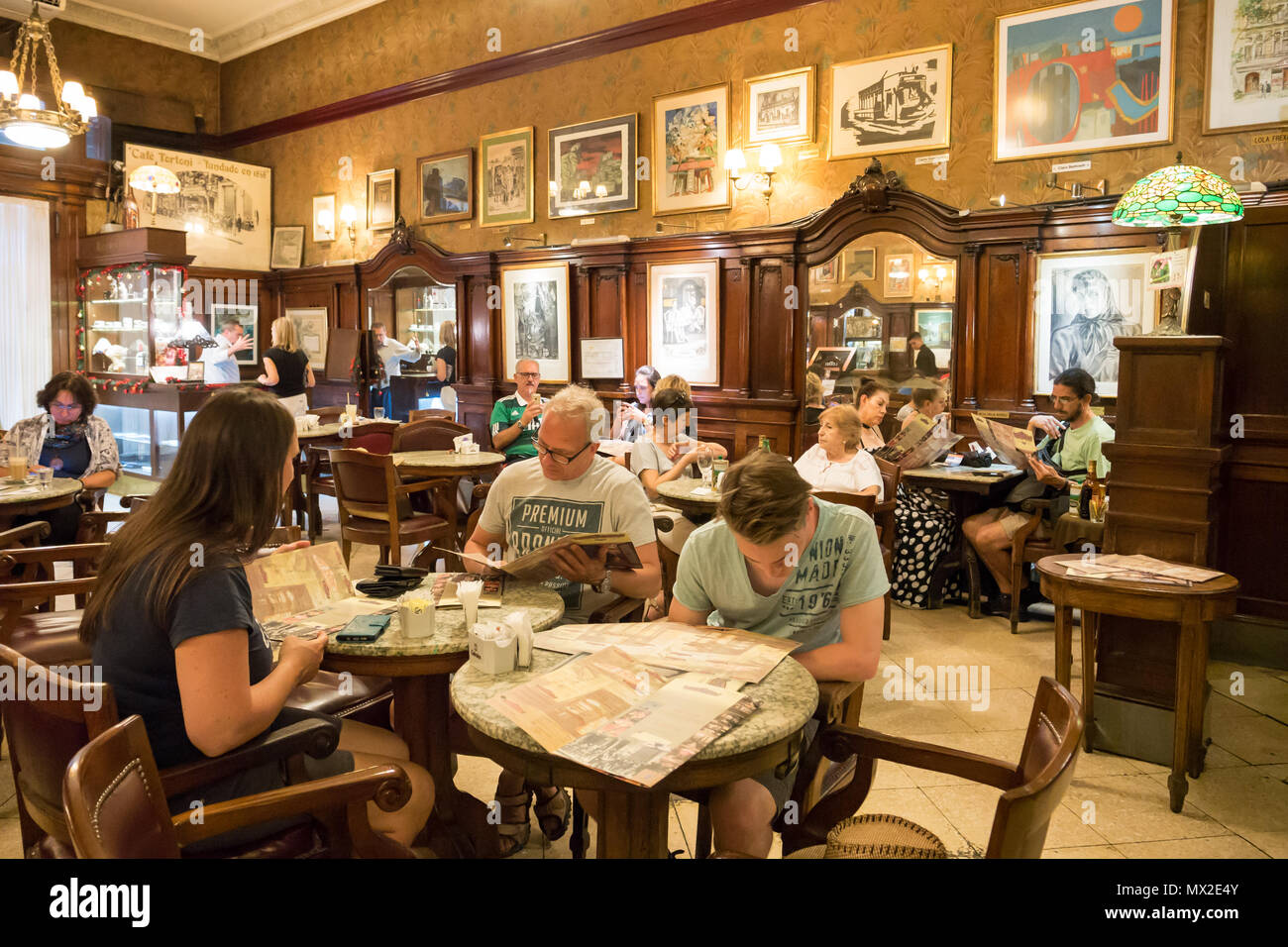 People in cafe Tortoni on Avenida de Mayo in city centre Microcentro in Monserrat district in capital Buenos Aires, Argentina Stock Photo